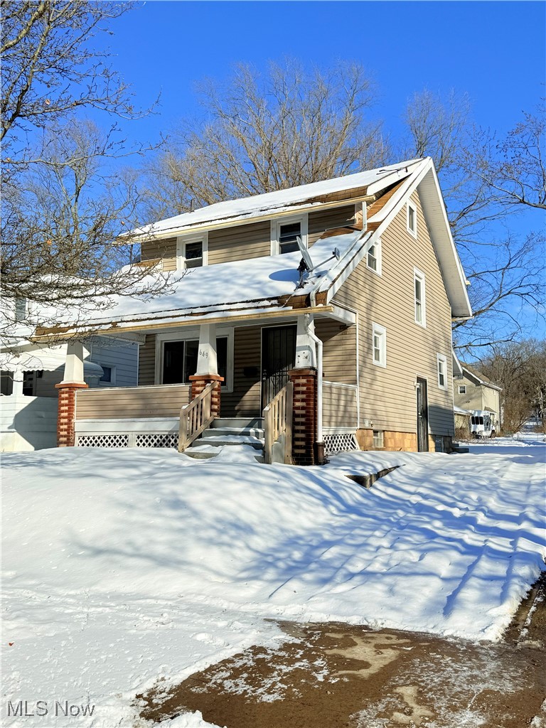 Front of house with driveway.
