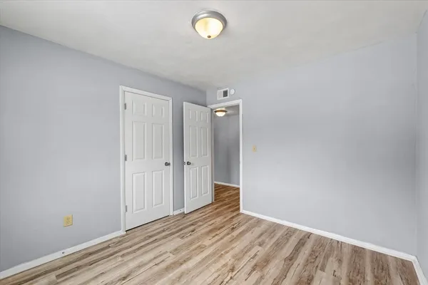 a view of room with window and hardwood floor
