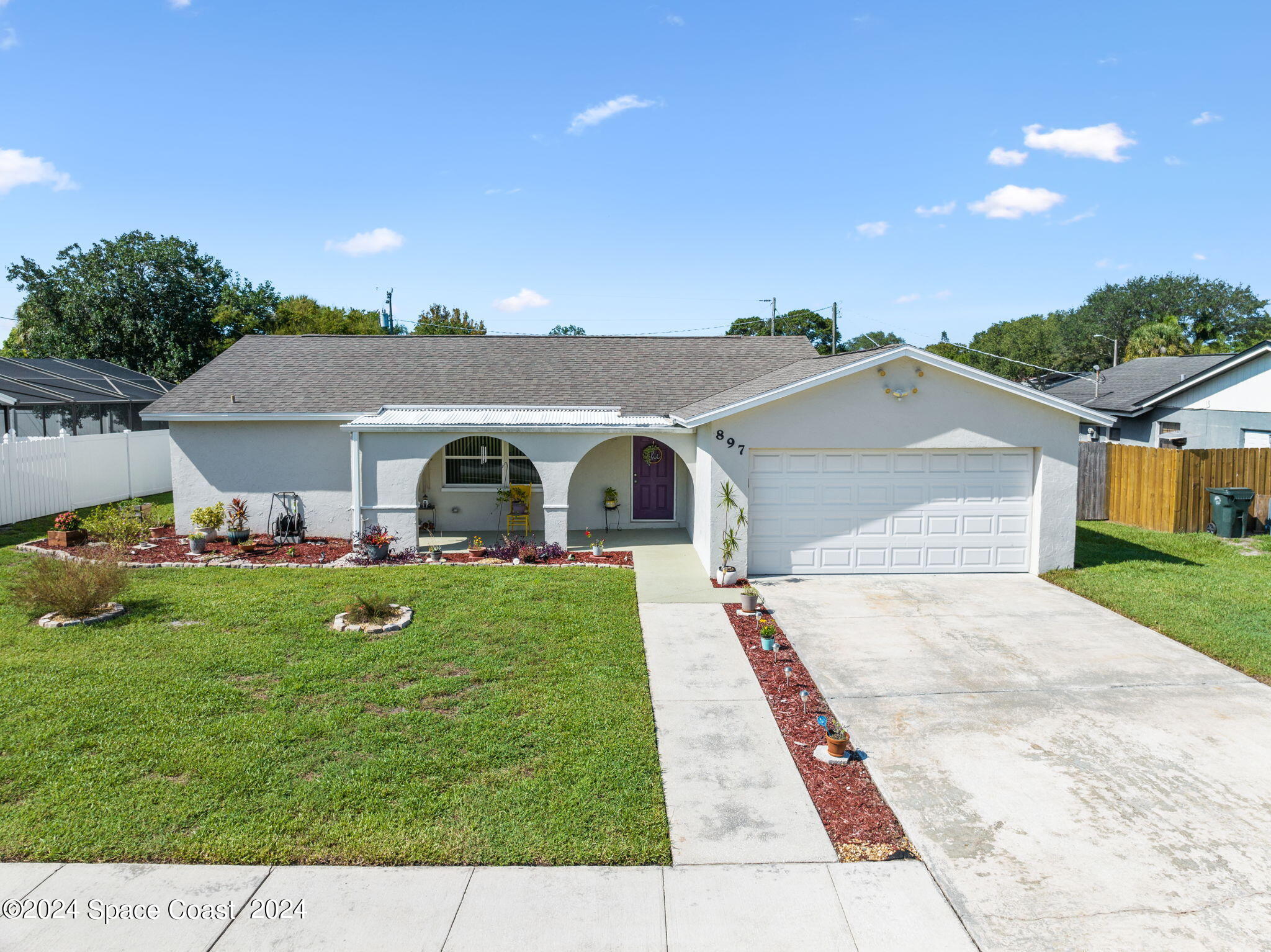 897 Brunswick Lane Rockledge, FL 32955 - Photo 1 of 41 a front view of a house with garden