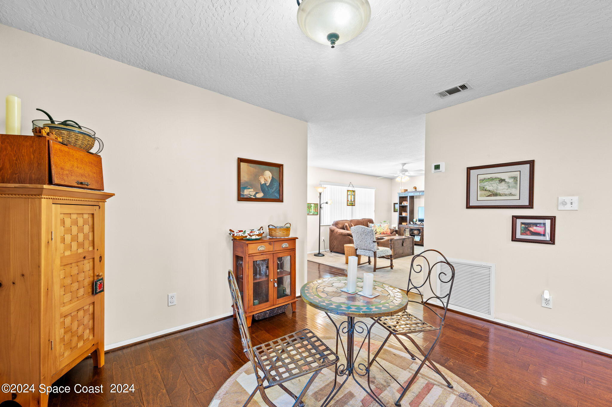 897 Brunswick Lane Rockledge, FL 32955 - Photo 11 of 41 a dining room with furniture and wooden floor