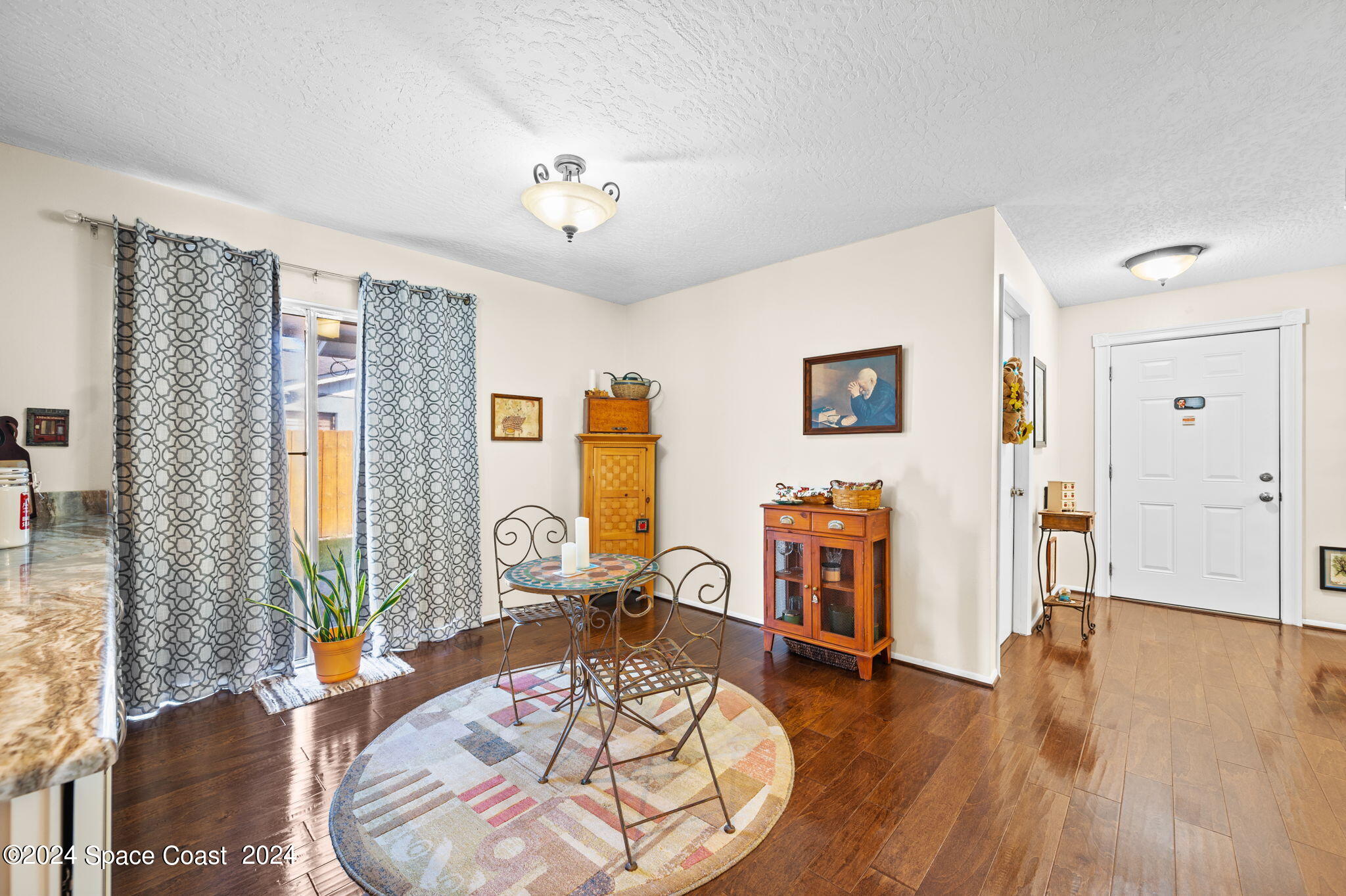 897 Brunswick Lane Rockledge, FL 32955 - Photo 13 of 41 a living room with furniture and a wooden floor