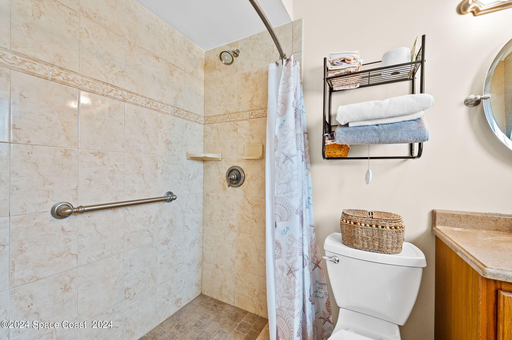 897 Brunswick Lane Rockledge, FL 32955 - Photo 17 of 41 a bathroom with a granite countertop shower and a sink