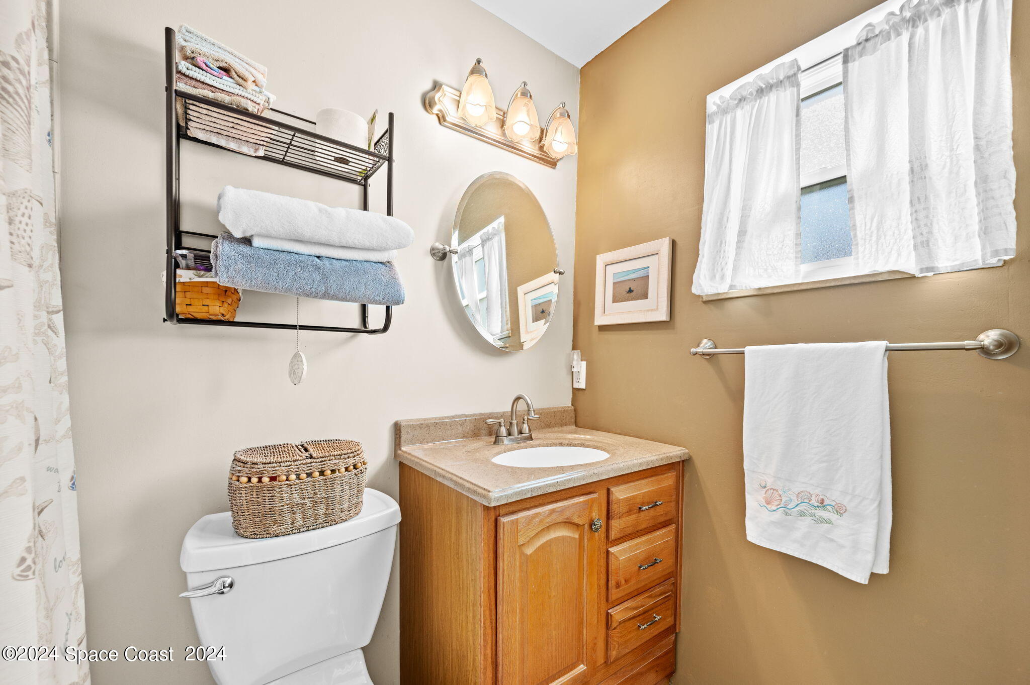 897 Brunswick Lane Rockledge, FL 32955 - Photo 18 of 41 a bathroom with a sink and a mirror