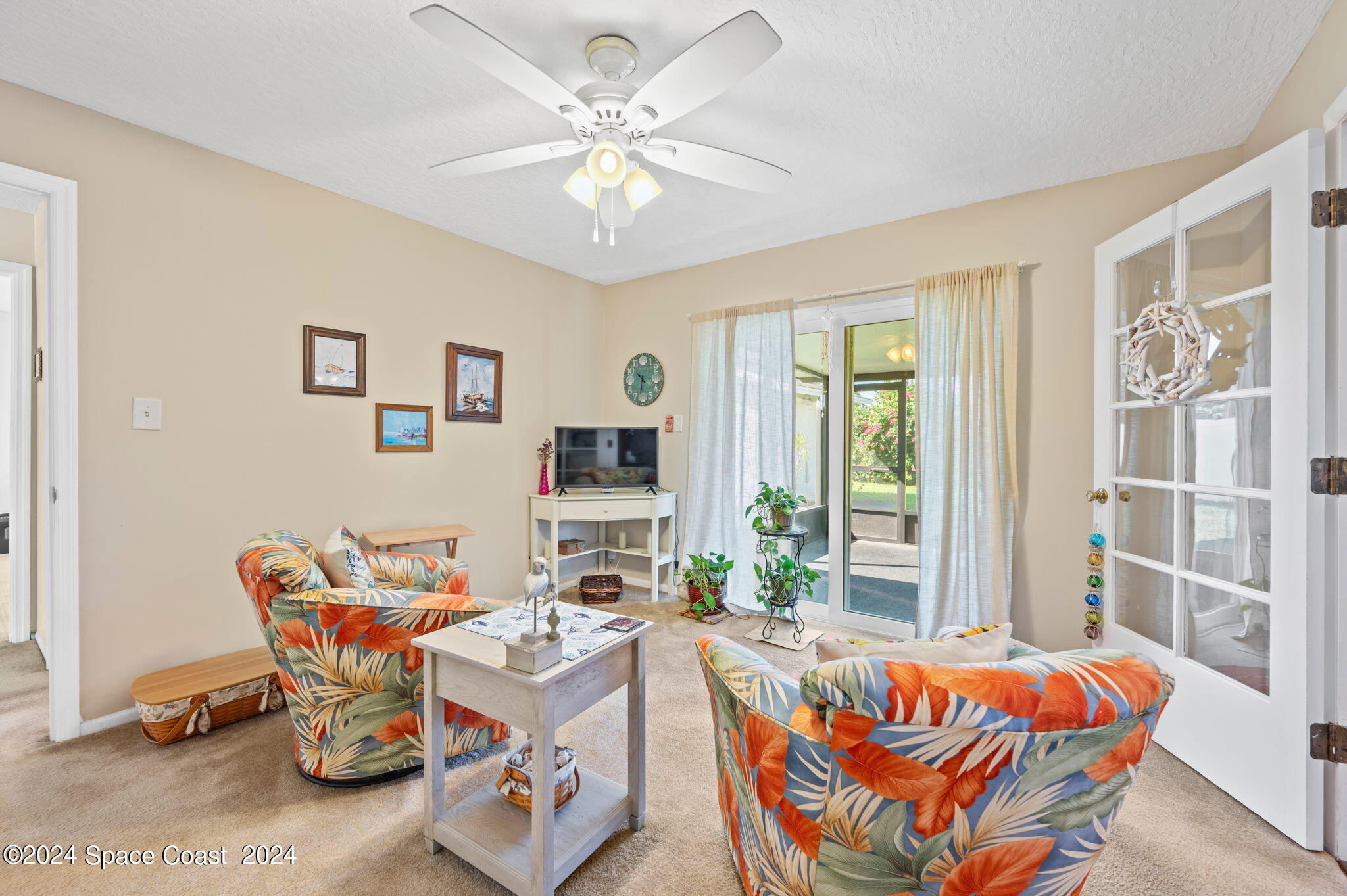 897 Brunswick Lane Rockledge, FL 32955 - Photo 20 of 41 a living room with furniture and a large window