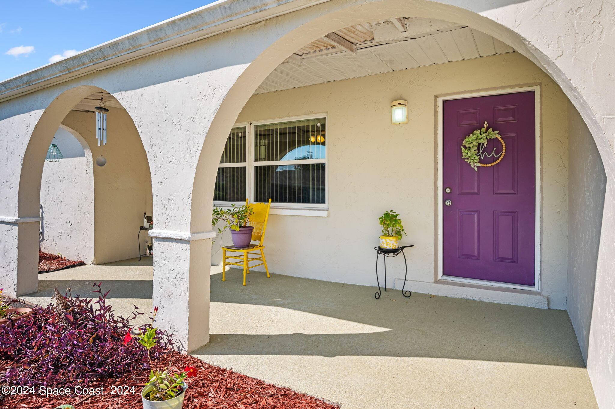 897 Brunswick Lane Rockledge, FL 32955 - Photo 2 of 41 a front view of a house with a garden