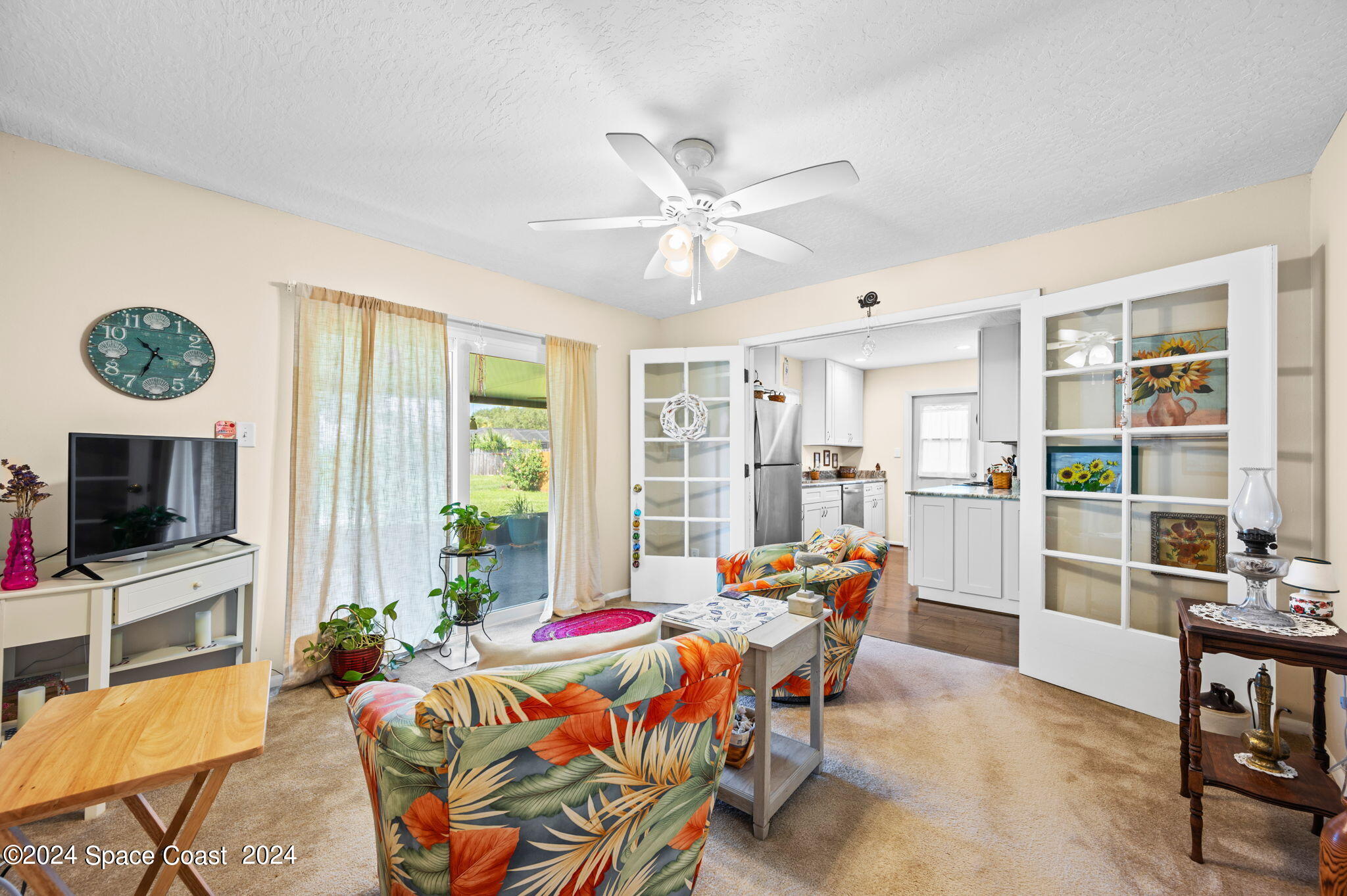 897 Brunswick Lane Rockledge, FL 32955 - Photo 21 of 41 a living room with furniture and a flat screen tv