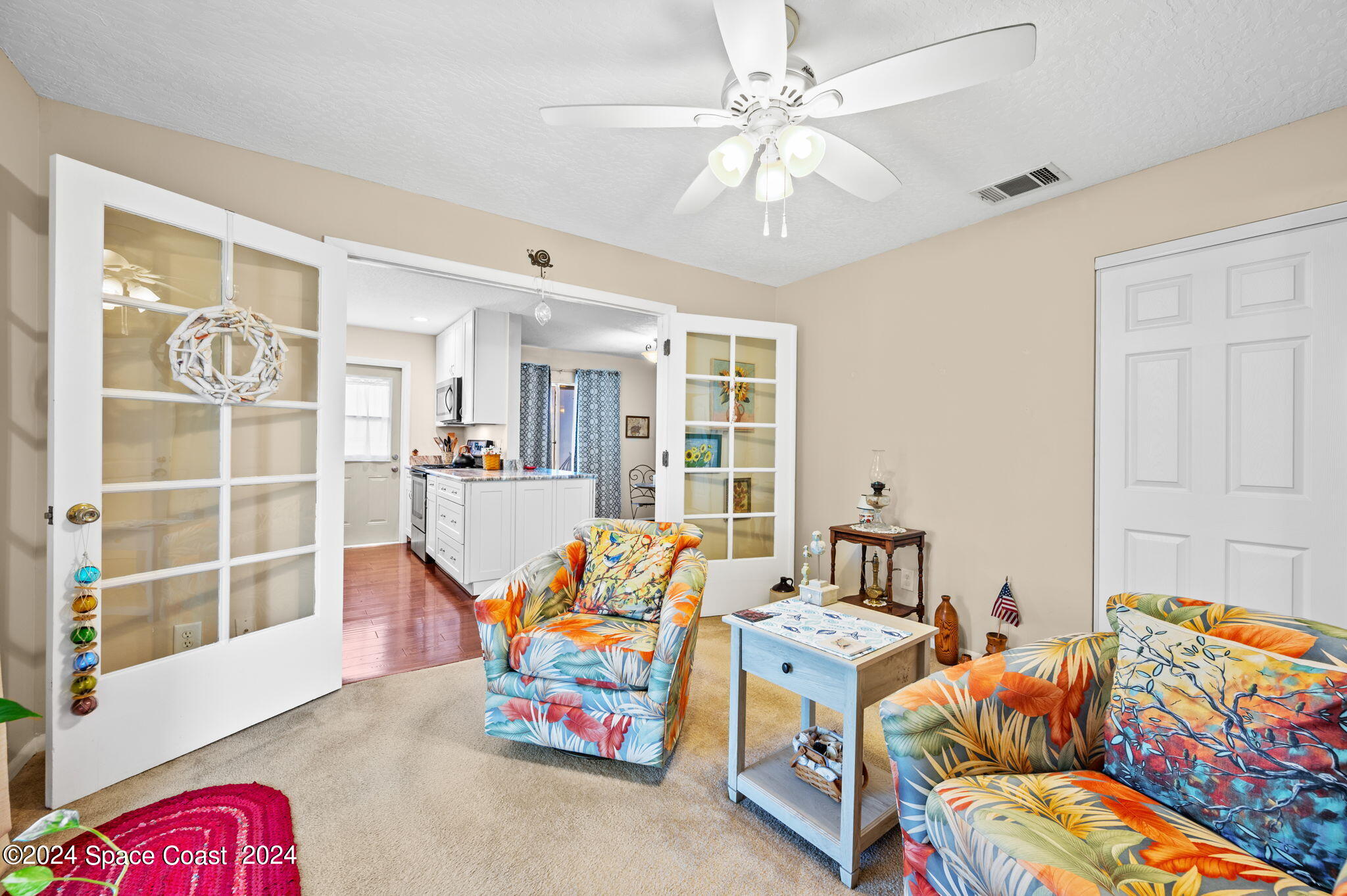 897 Brunswick Lane Rockledge, FL 32955 - Photo 22 of 41 a bed room with furniture and a chandelier