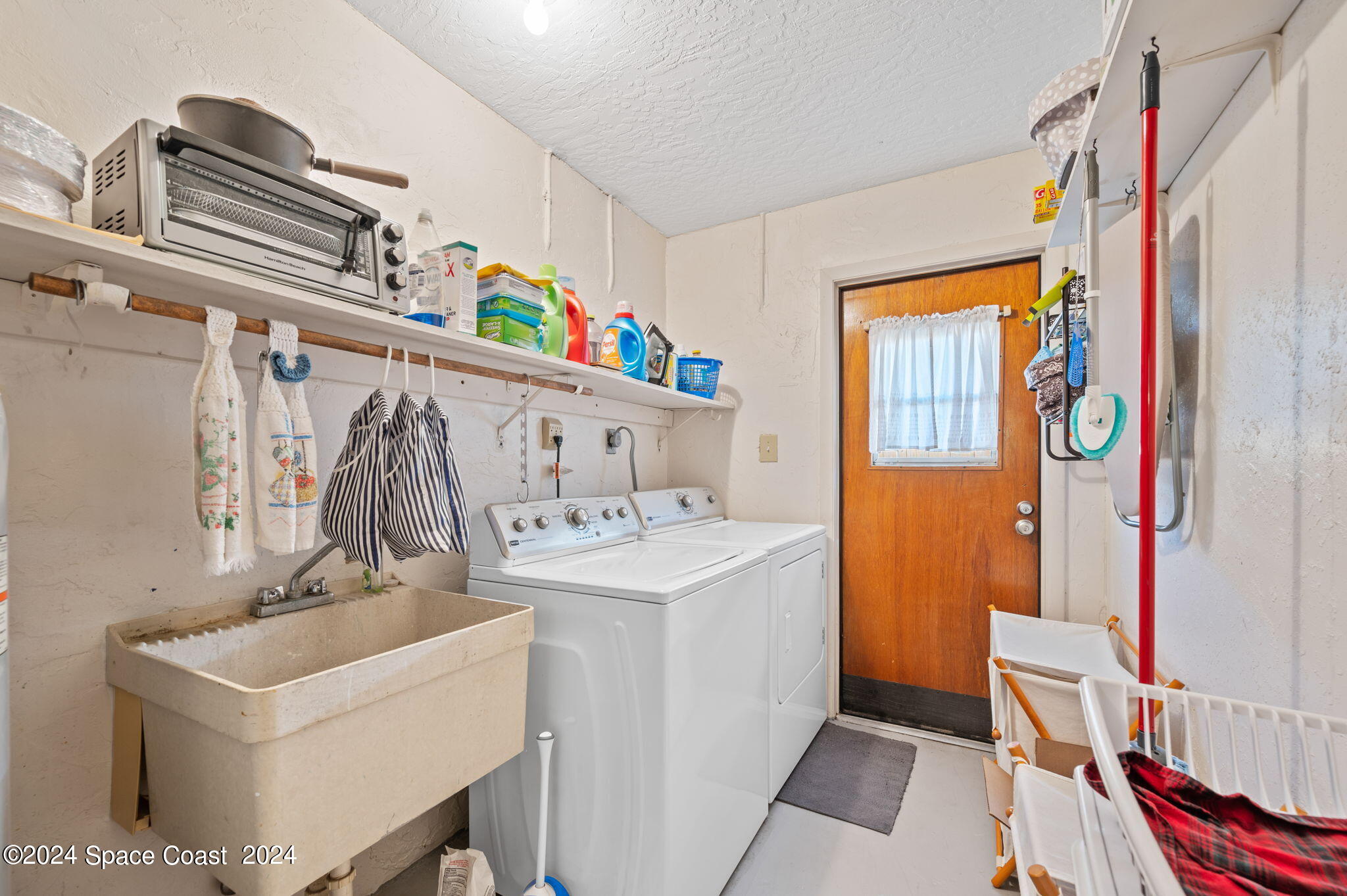 897 Brunswick Lane Rockledge, FL 32955 - Photo 25 of 41 a bathroom with a sink and a mirror