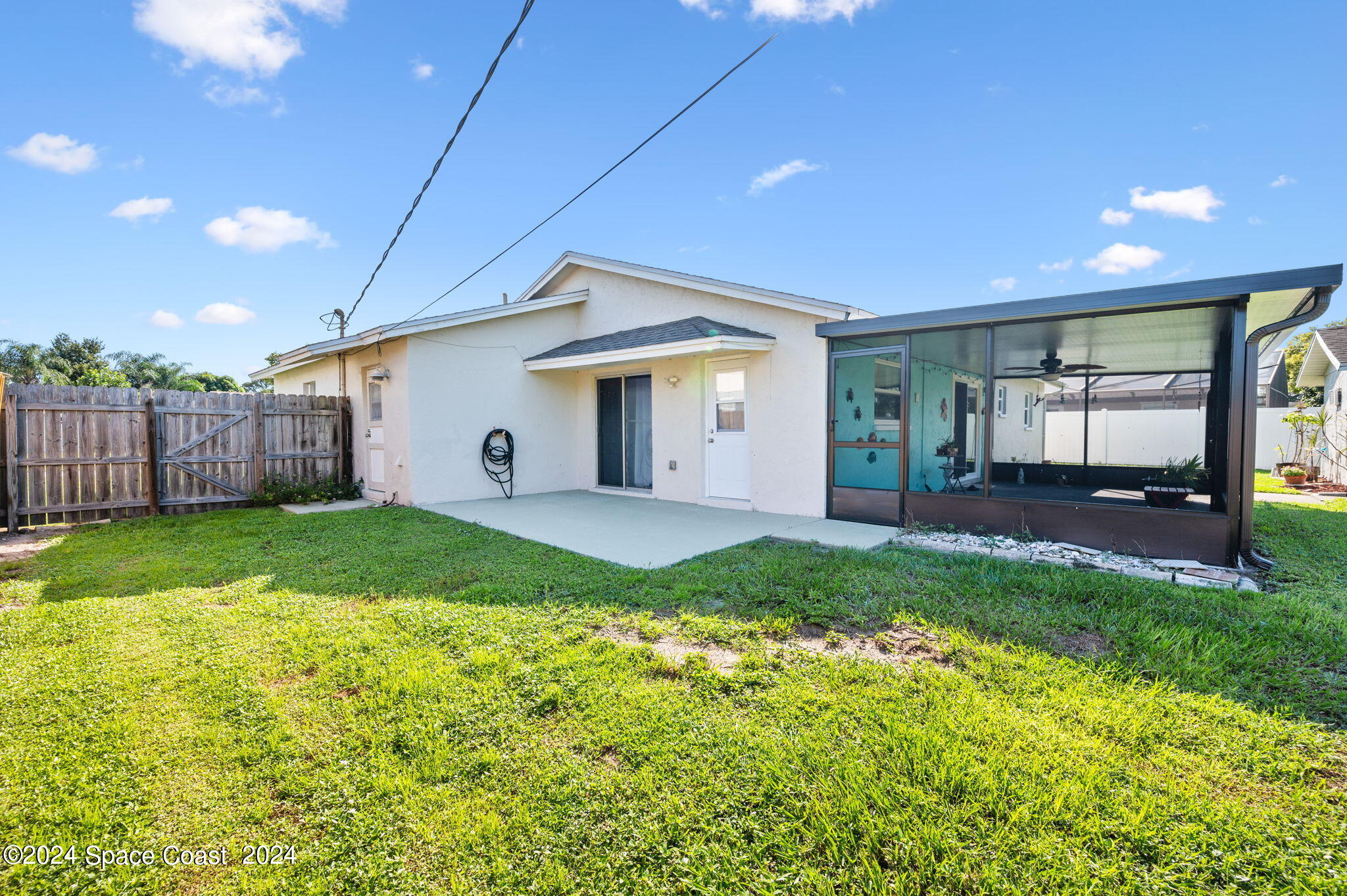 897 Brunswick Lane Rockledge, FL 32955 - Photo 32 of 41 a view of a house with backyard and porch
