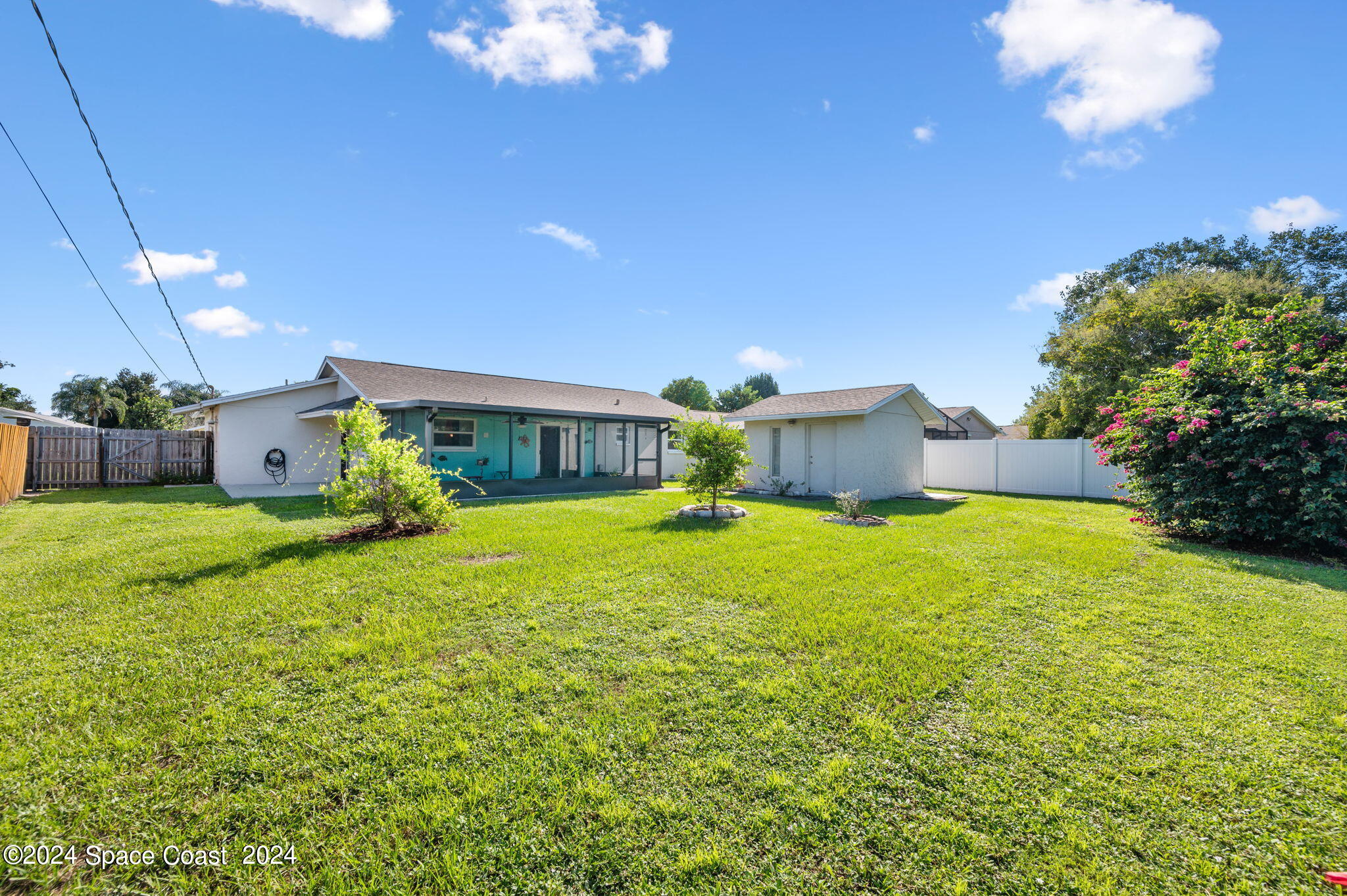 897 Brunswick Lane Rockledge, FL 32955 - Photo 33 of 41 a front view of a house with garden