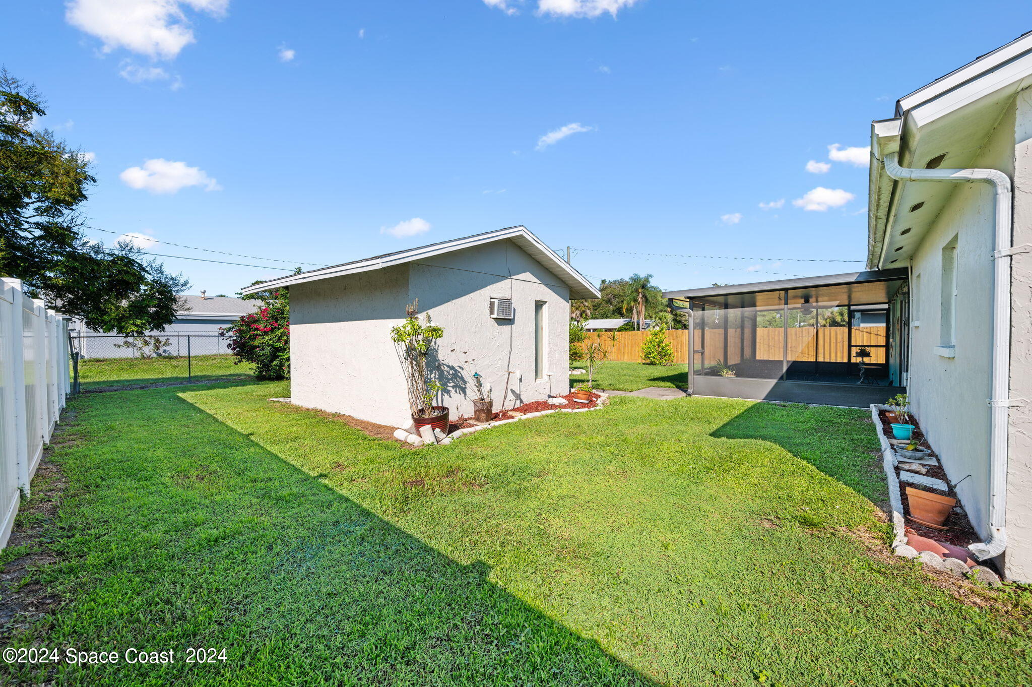 897 Brunswick Lane Rockledge, FL 32955 - Photo 35 of 41 a view of a back yard of the house