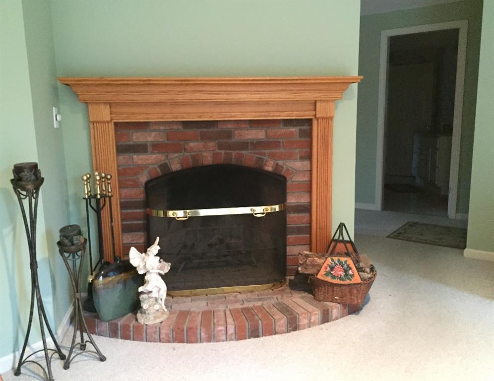 170 Kelleytown Road Bernard, ME 04612 - Photo 14 of 33 A brick fireplace in the living room