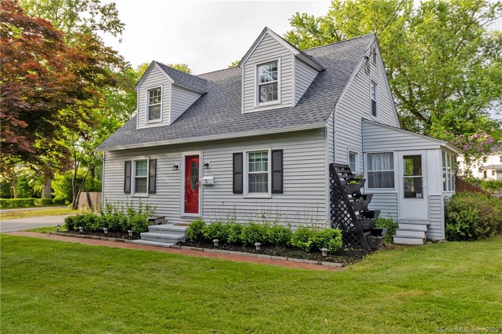 2 Foley Road Portland, CT 06480 - Photo 1 of 1 a front view of a house with a yard and outdoor seating