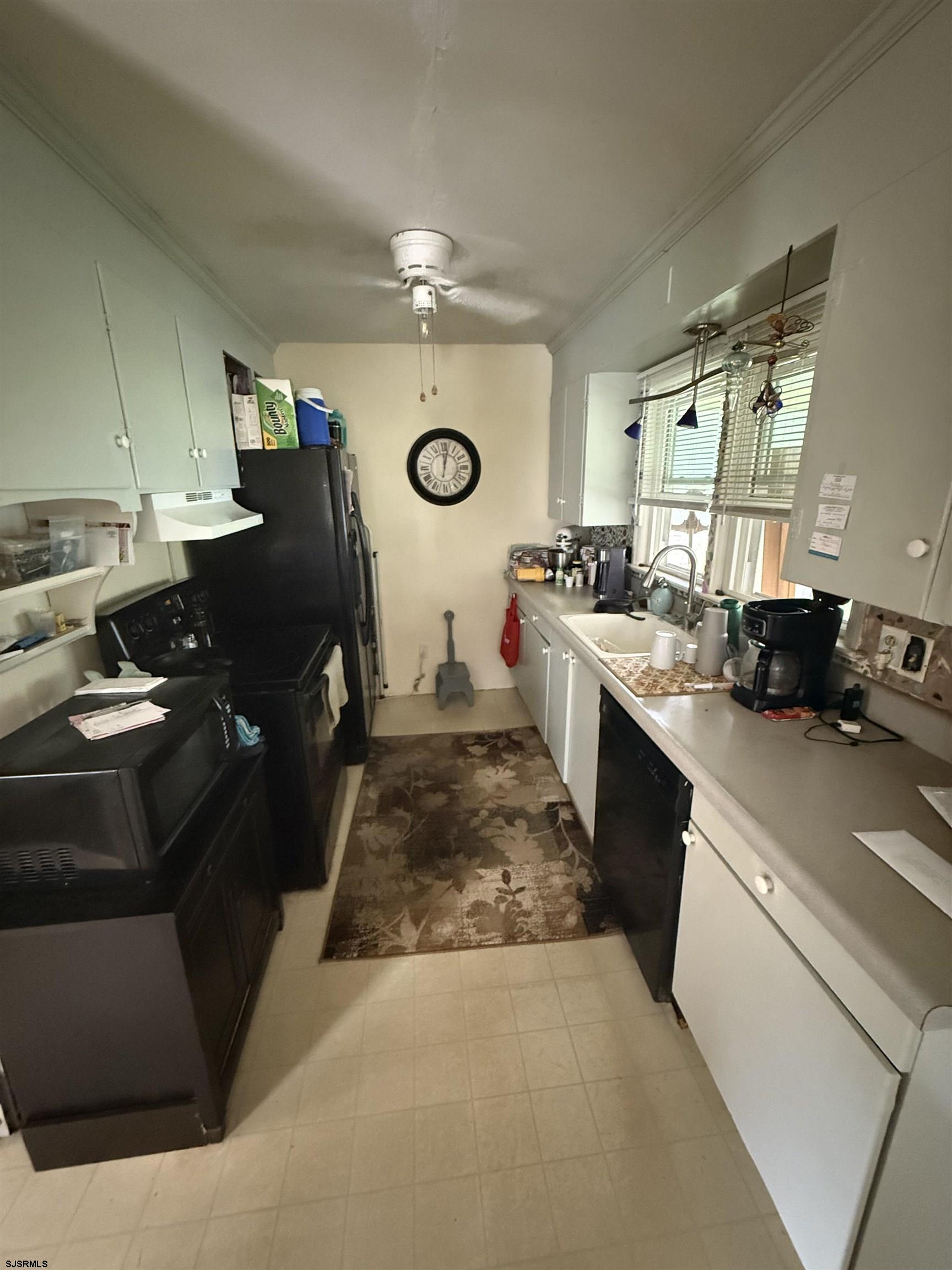 34 Back Neck Road Bridgeton, NJ 08302 - Photo 9 of 38 a kitchen with a stove and a refrigerator