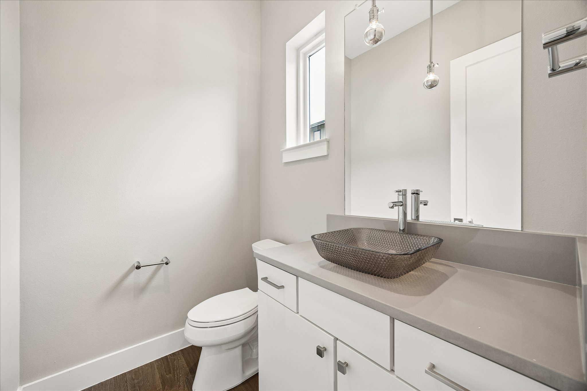 5006 Pecan Springs Road, Unit 6 Austin, TX 78723 - Photo 15 of 30 A well-lit powder room showcasing a unique vessel sink and a broad vanity.