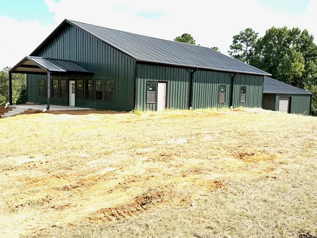 a house with yard in front of it