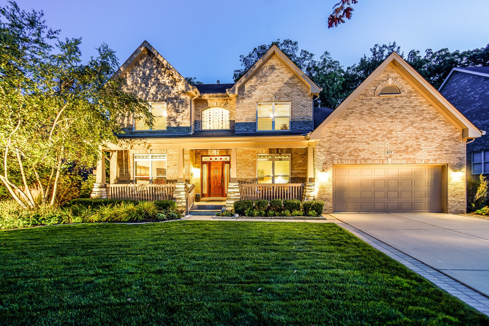 617 West Ruhl Road Palatine, IL 60074 - Photo 2 of 47 a front view of a house with a yard and trees