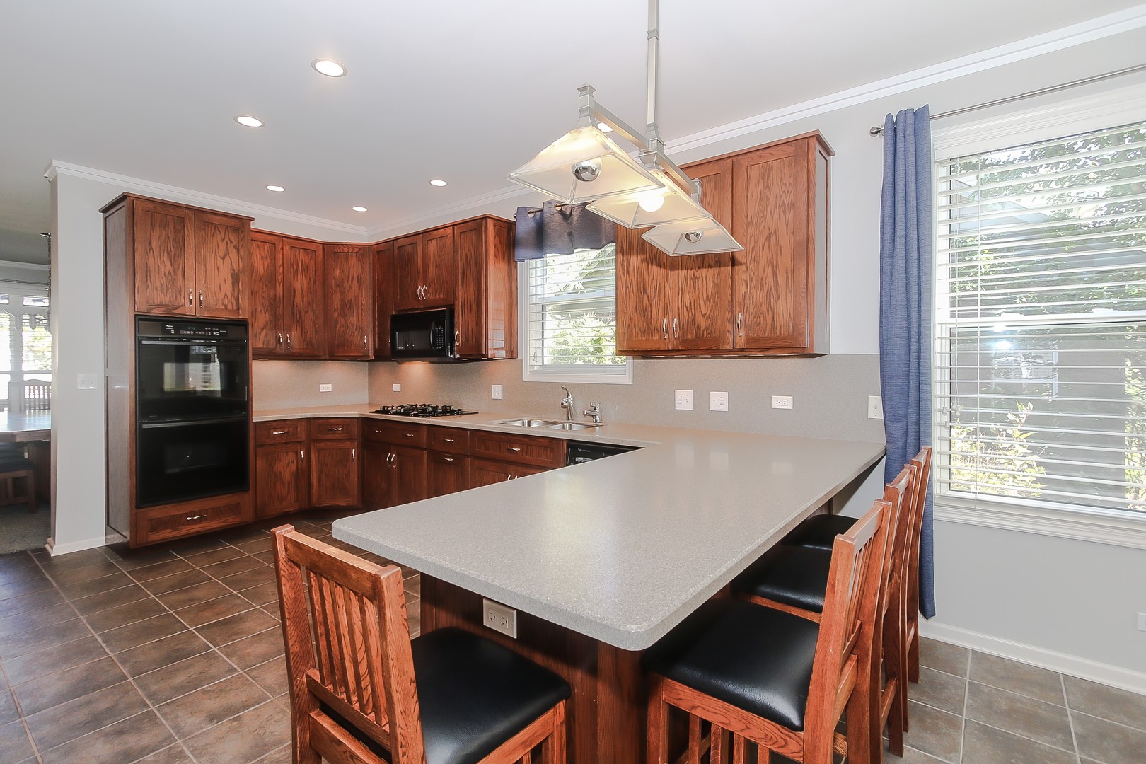 617 West Ruhl Road Palatine, IL 60074 - Photo 11 of 47 a kitchen with stainless steel appliances granite countertop a sink a stove and a refrigerator