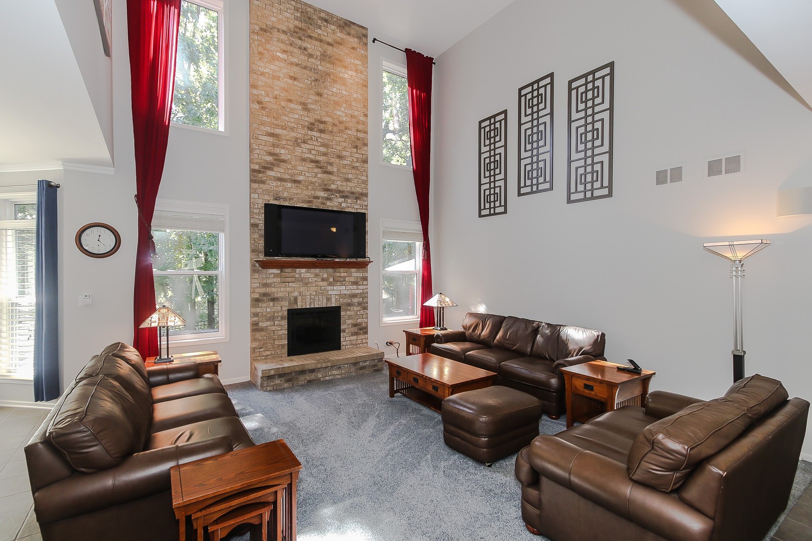 617 West Ruhl Road Palatine, IL 60074 - Photo 15 of 47 a living room with furniture a flat screen tv and a fireplace