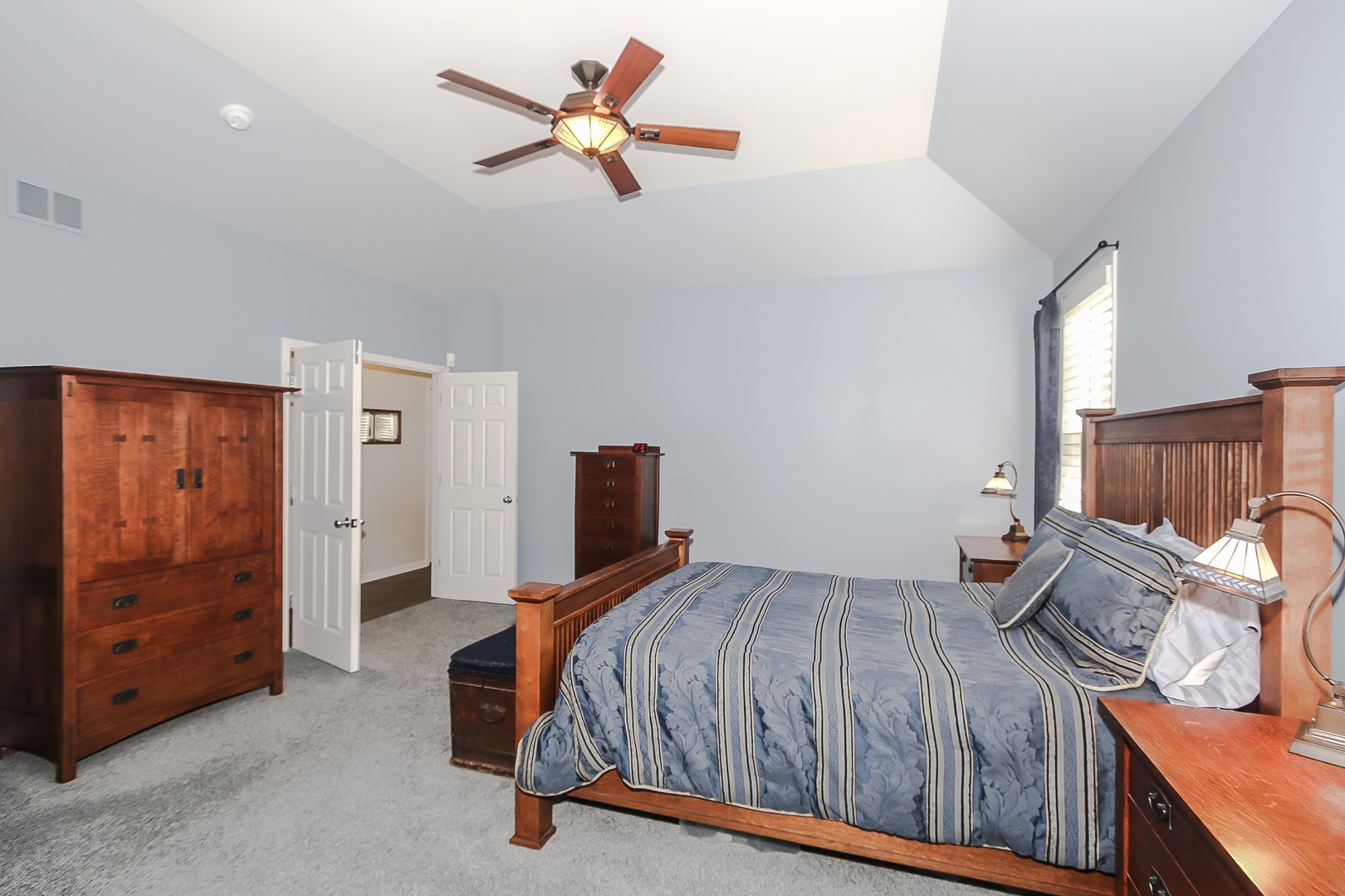 617 West Ruhl Road Palatine, IL 60074 - Photo 21 of 47 a bedroom with a bed and a dresser