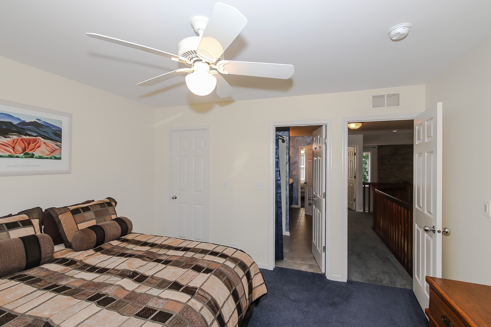 617 West Ruhl Road Palatine, IL 60074 - Photo 28 of 47 a bedroom with a bed and a chandelier