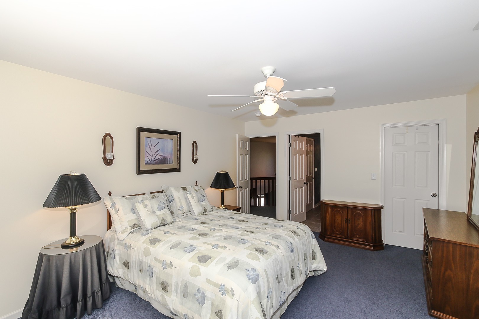 617 West Ruhl Road Palatine, IL 60074 - Photo 32 of 47 a bedroom with a bed and a lamp
