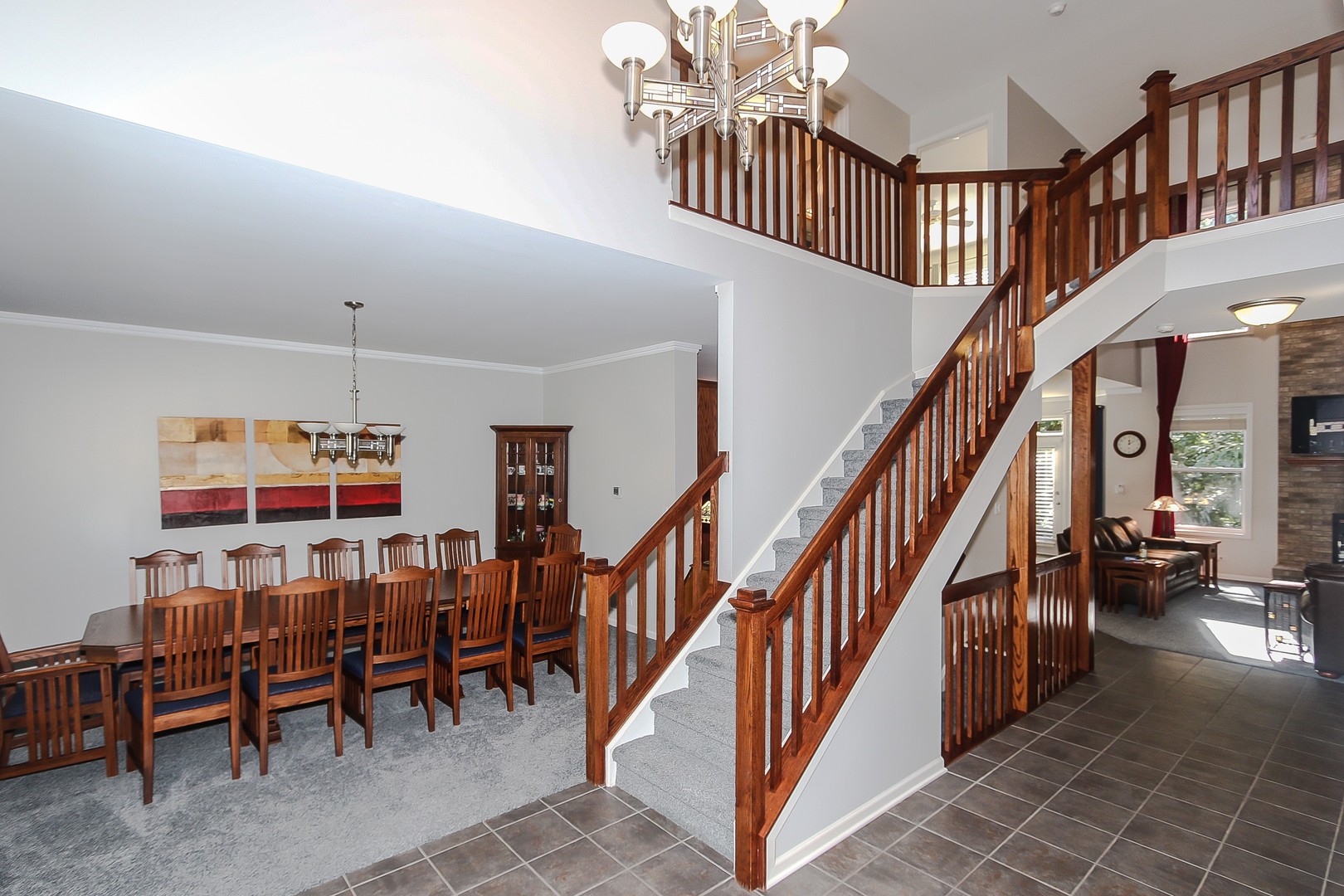 617 West Ruhl Road Palatine, IL 60074 - Photo 5 of 47 a dining room with furniture entryway and stairs
