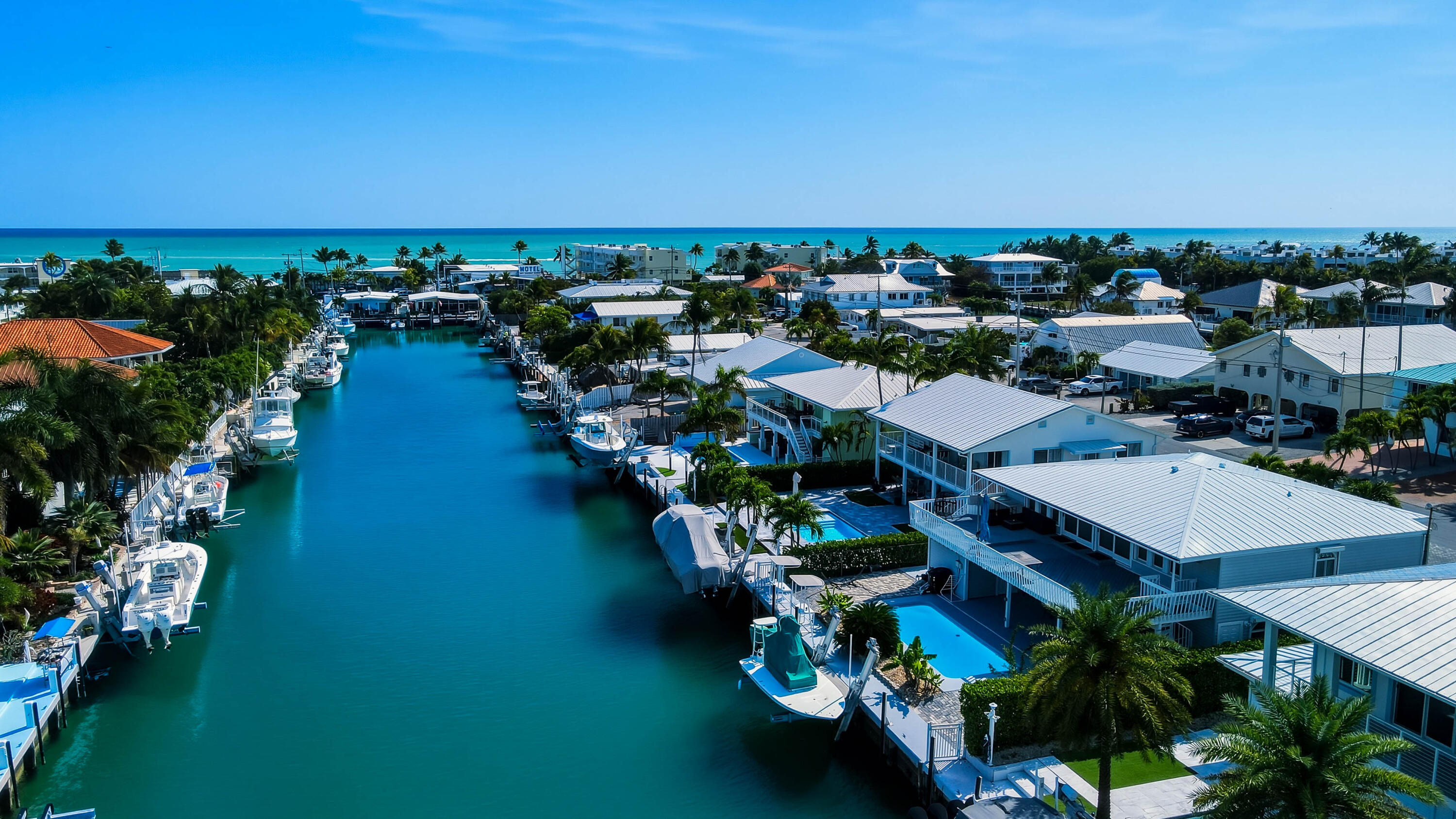 320 5th Street Key Colony Beach, FL 33051 - Photo 6 of 53 an aerial view of a city with lots of residential buildings ocean and mountain view in back