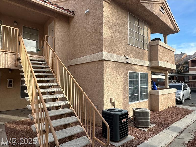 1830 North Pecos Road, Unit 230 Las Vegas, NV 89115 - Photo 2 of 16 A classic exterior with stucco finish and a private staircase provides inviting curb appeal.