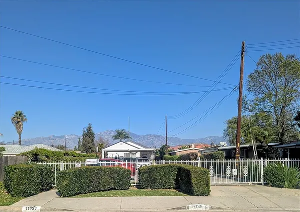 a view of a street with a building in the background