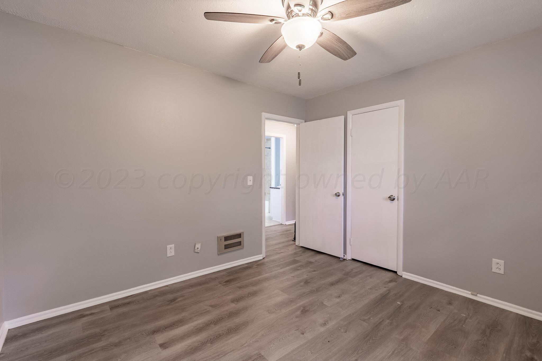 5130 Leland Drive Amarillo, TX 79110 - Photo 14 of 22 wooden floor in an empty room