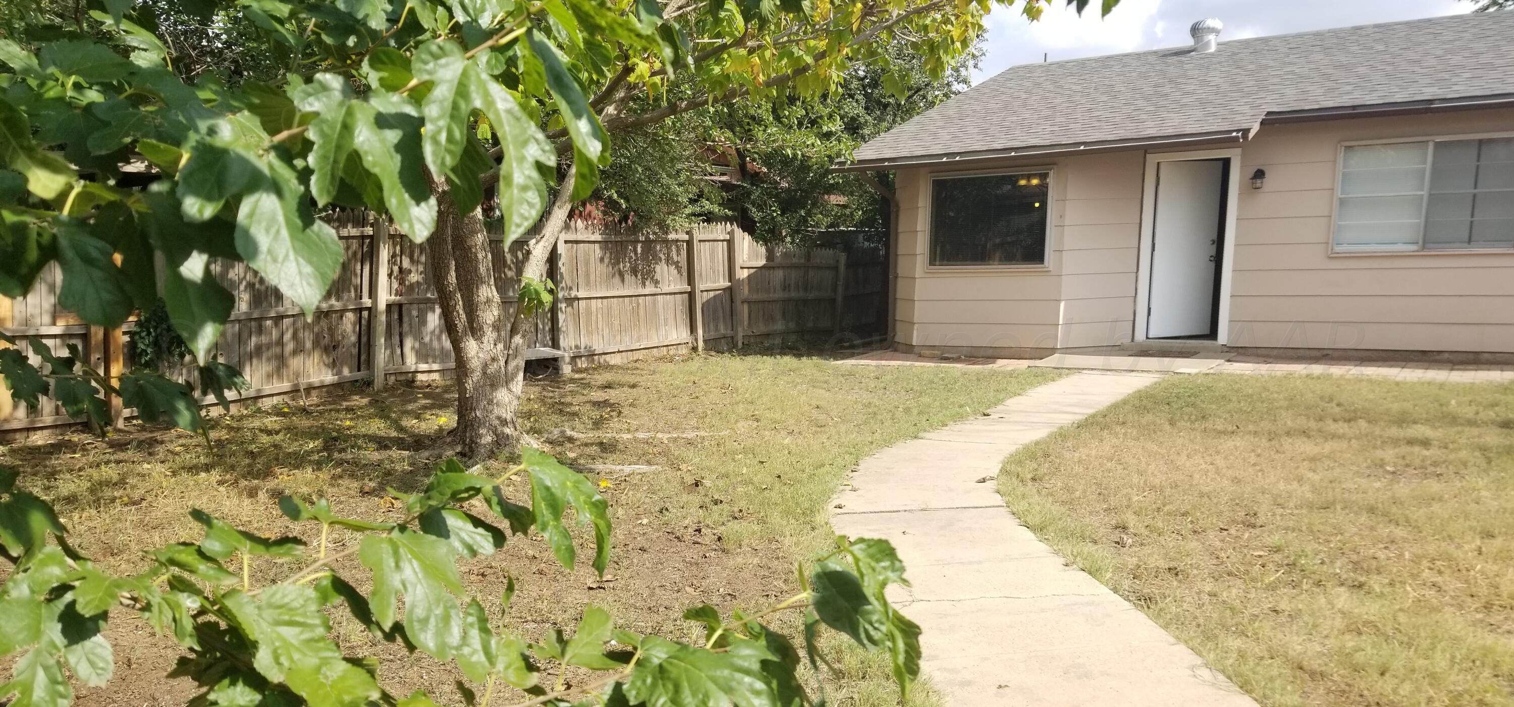 5130 Leland Drive Amarillo, TX 79110 - Photo 22 of 22 a view of yellow house with large trees