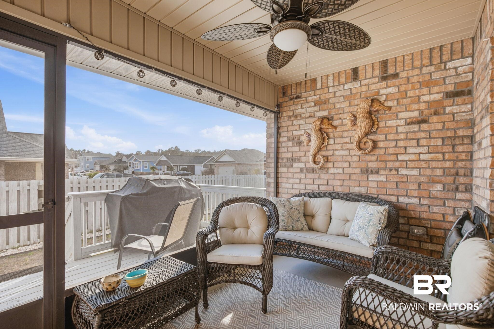 22596 Respite Lane Foley, AL 36535 - Photo 28 of 34 Sunroom / solarium with ceiling fan, a residential view, and outdoor lounge area