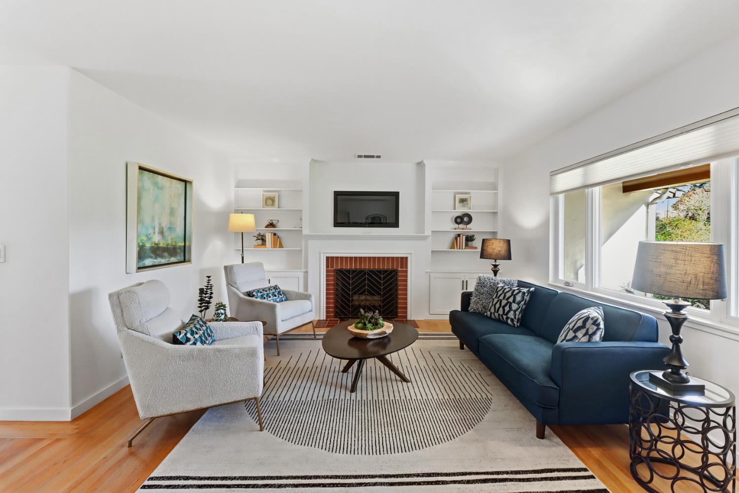 709 A Street Davis, CA 95616 - Photo 12 of 74 a living room with furniture a fireplace and a flat screen tv