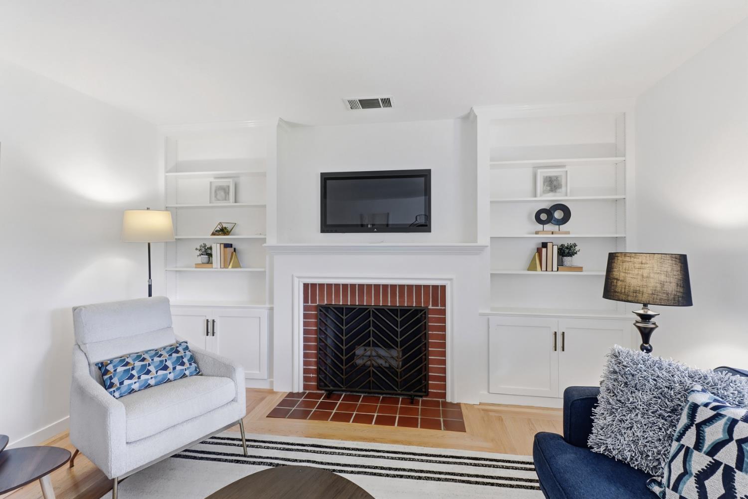 709 A Street Davis, CA 95616 - Photo 13 of 74 a living room with furniture a fireplace and a flat screen tv