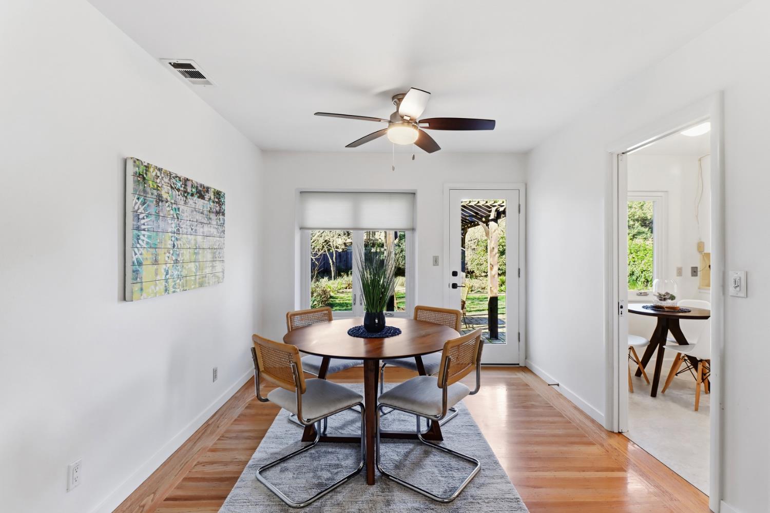 709 A Street Davis, CA 95616 - Photo 18 of 74 a dining room with furniture a chandelier and wooden floor