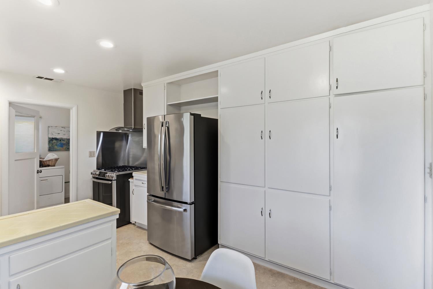 709 A Street Davis, CA 95616 - Photo 19 of 74 a bathroom with a refrigerator toilet and microwave