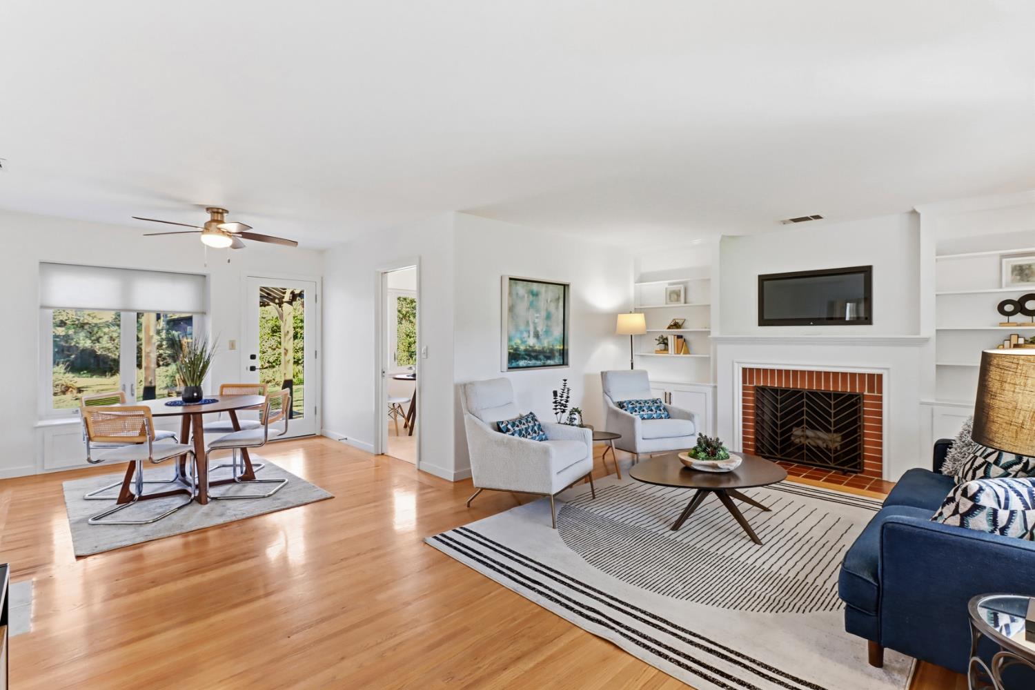 709 A Street Davis, CA 95616 - Photo 2 of 74 a living room with furniture a fireplace and a flat screen tv