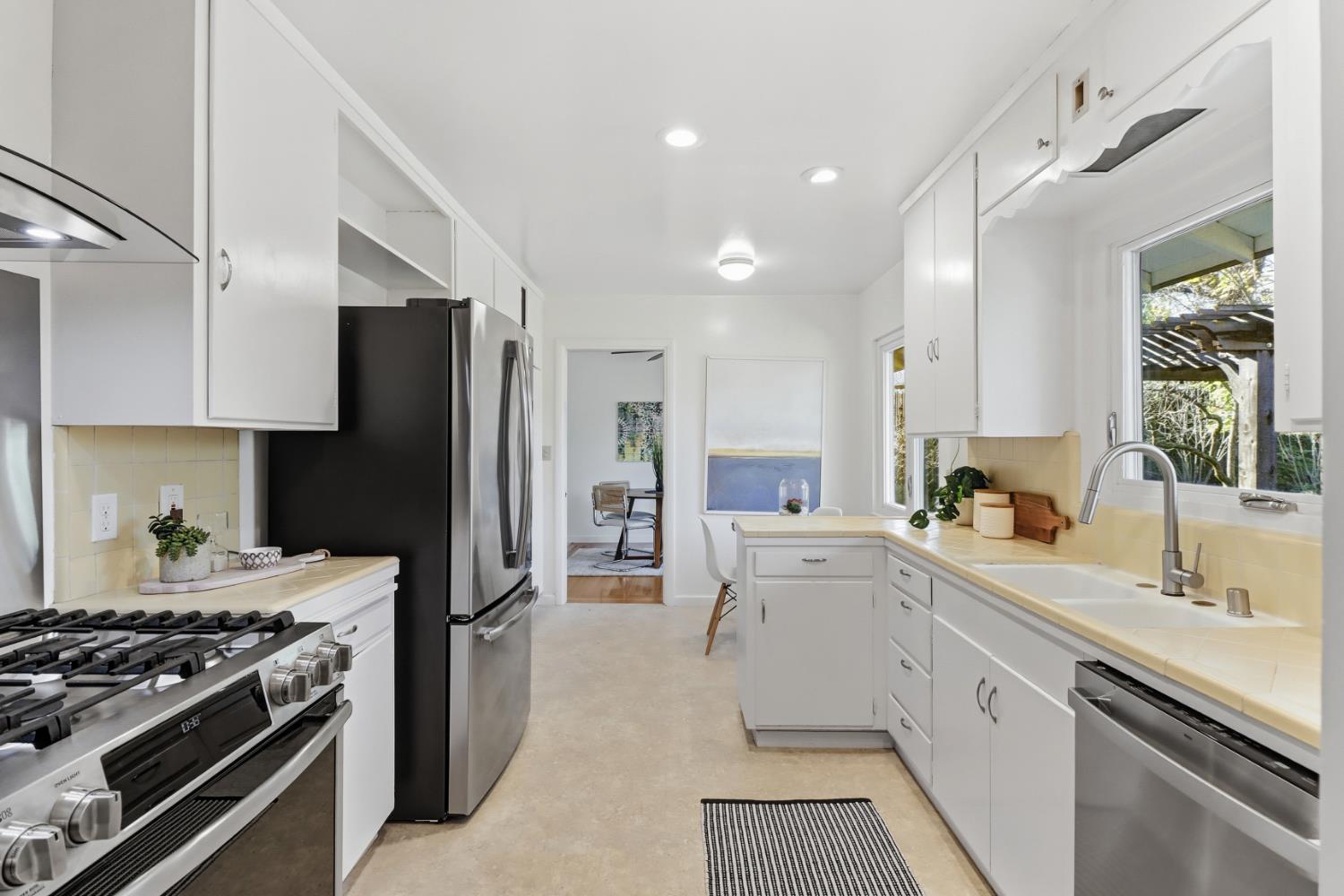 709 A Street Davis, CA 95616 - Photo 24 of 74 a kitchen with a sink stove and refrigerator