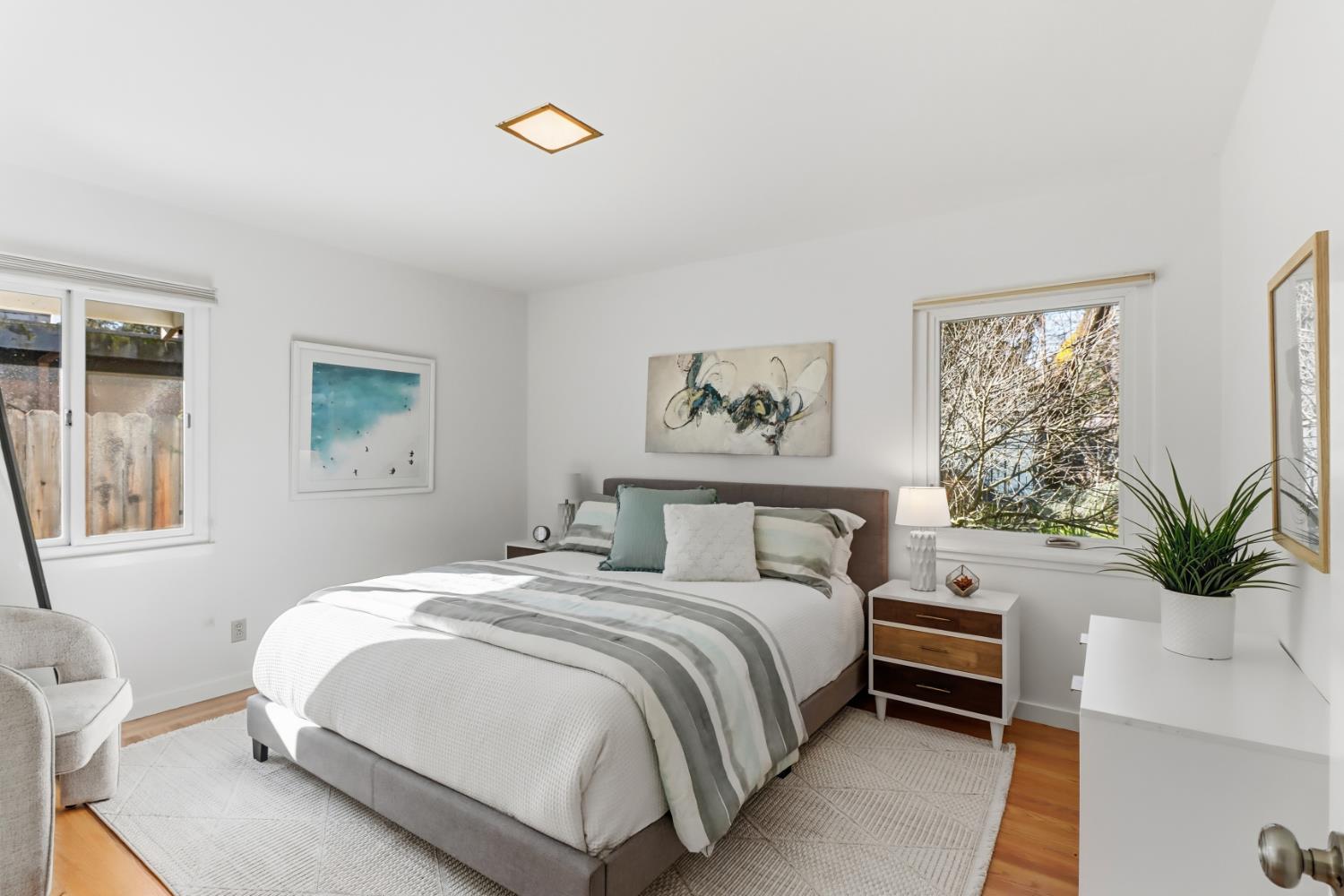 709 A Street Davis, CA 95616 - Photo 28 of 74 a bedroom with a bed plant and a window