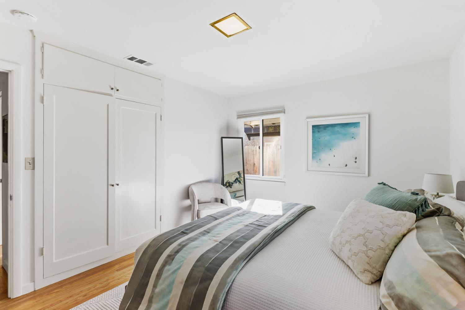 709 A Street Davis, CA 95616 - Photo 29 of 74 a bedroom with a bed and a chandelier