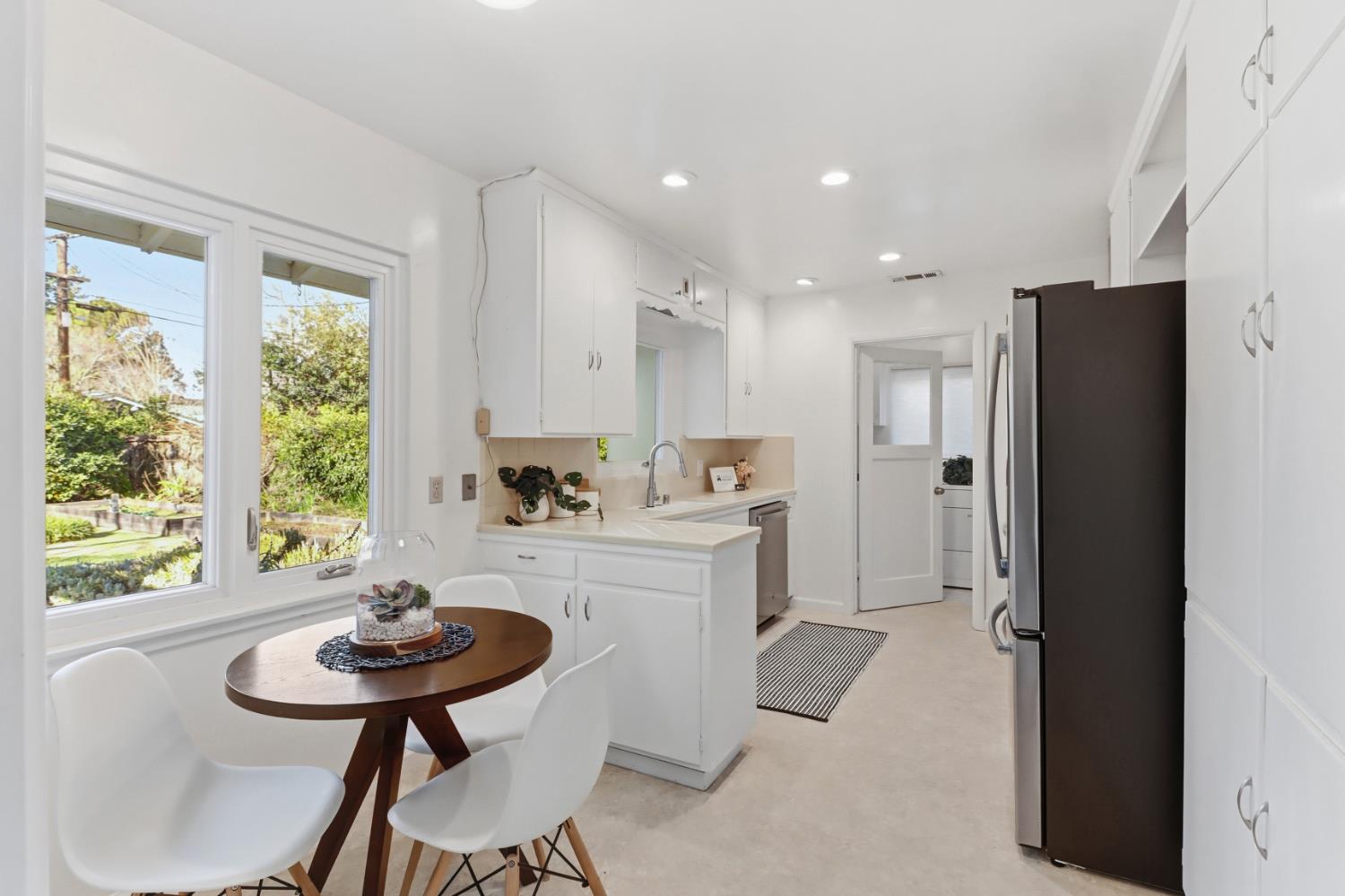 709 A Street Davis, CA 95616 - Photo 3 of 74 a kitchen with stainless steel appliances kitchen island furniture and a refrigerator