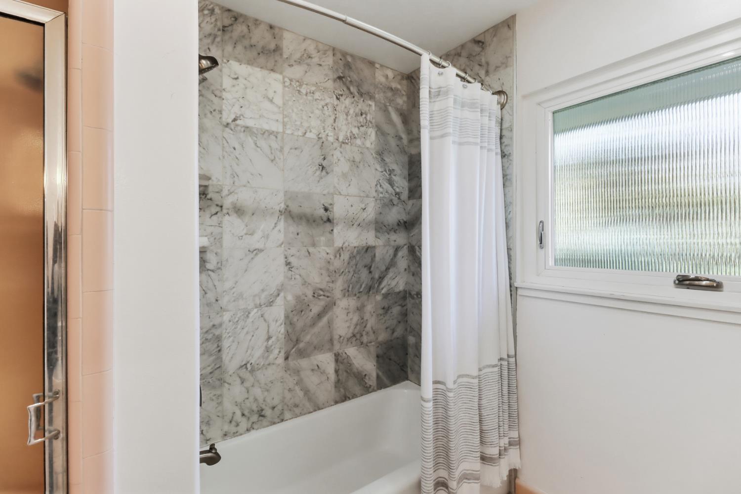 709 A Street Davis, CA 95616 - Photo 33 of 74 a bathroom with a shower and a sink