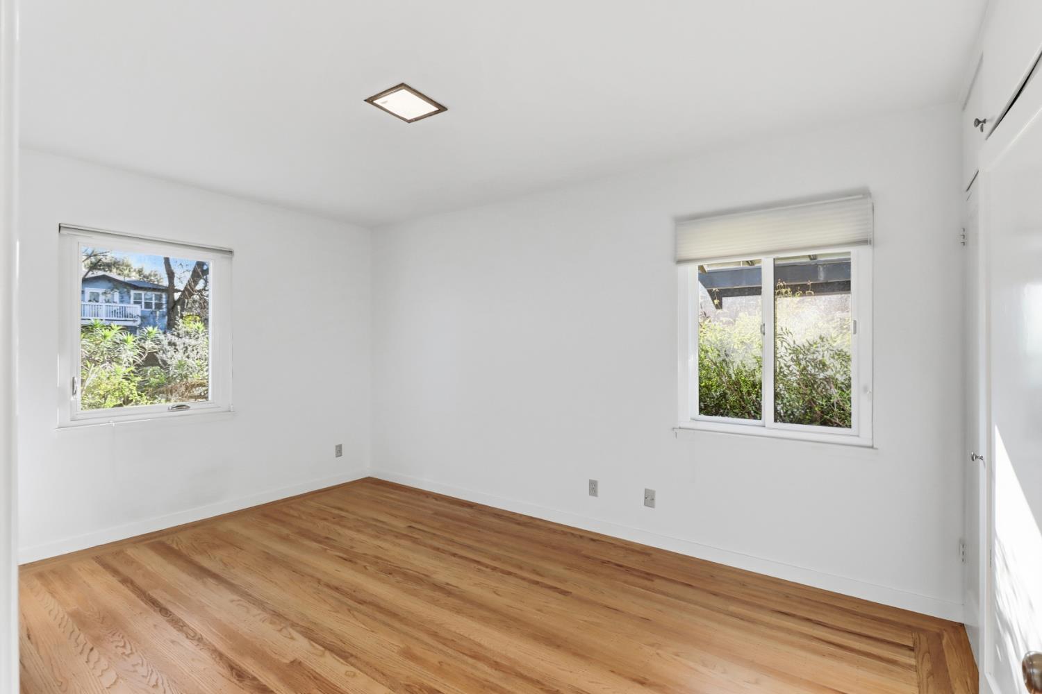 709 A Street Davis, CA 95616 - Photo 36 of 74 a view of a room with wooden floor and window
