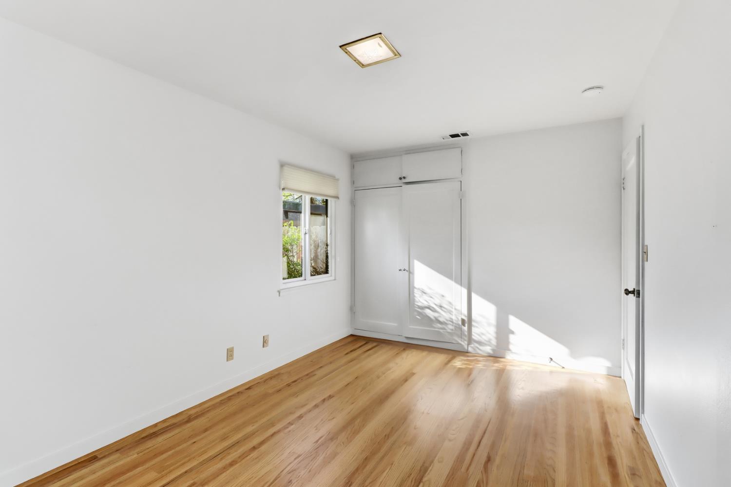 709 A Street Davis, CA 95616 - Photo 38 of 74 a view of empty room with wooden floor and fan