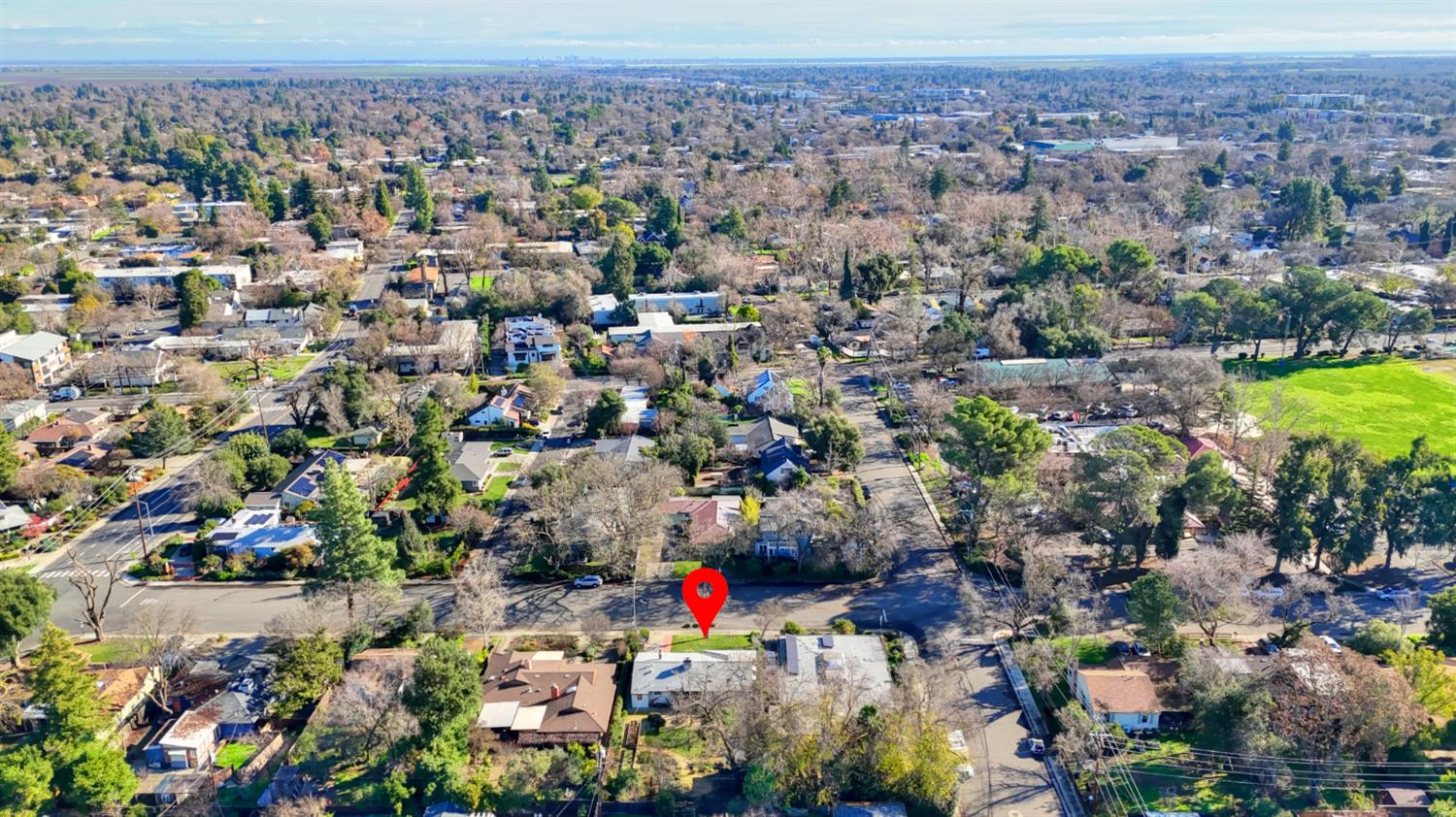709 A Street Davis, CA 95616 - Photo 73 of 74 an aerial view of a houses with a lush green hillside