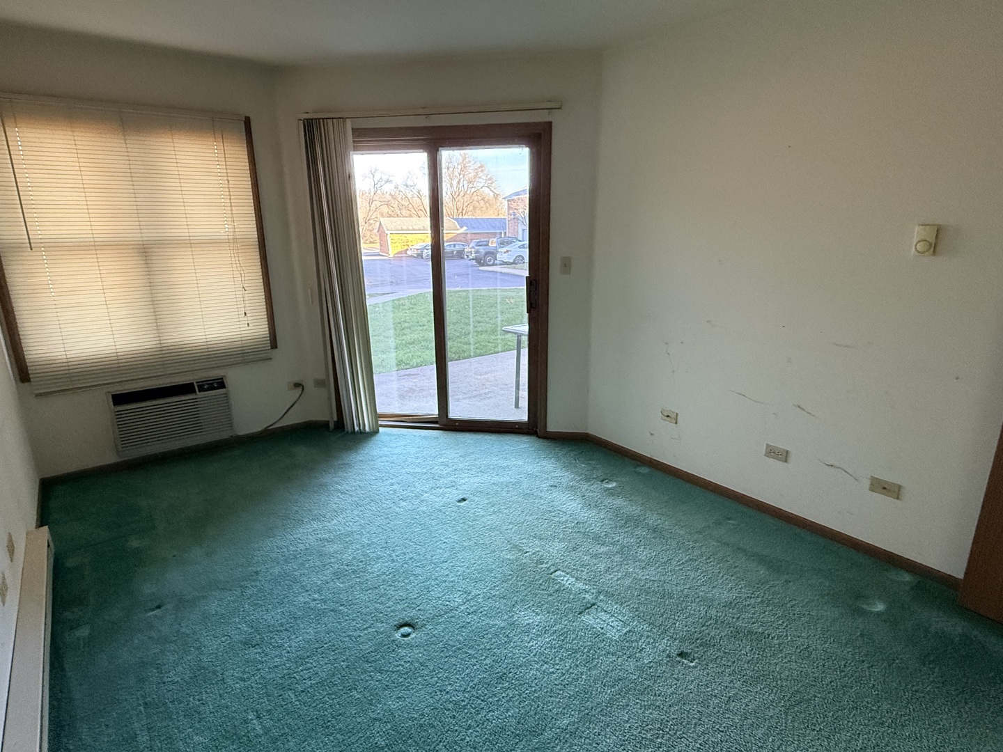 1345 Cunat Court, Unit 1B Lake In The Hills, IL 60156 - Photo 11 of 16 a view of an empty room with a window