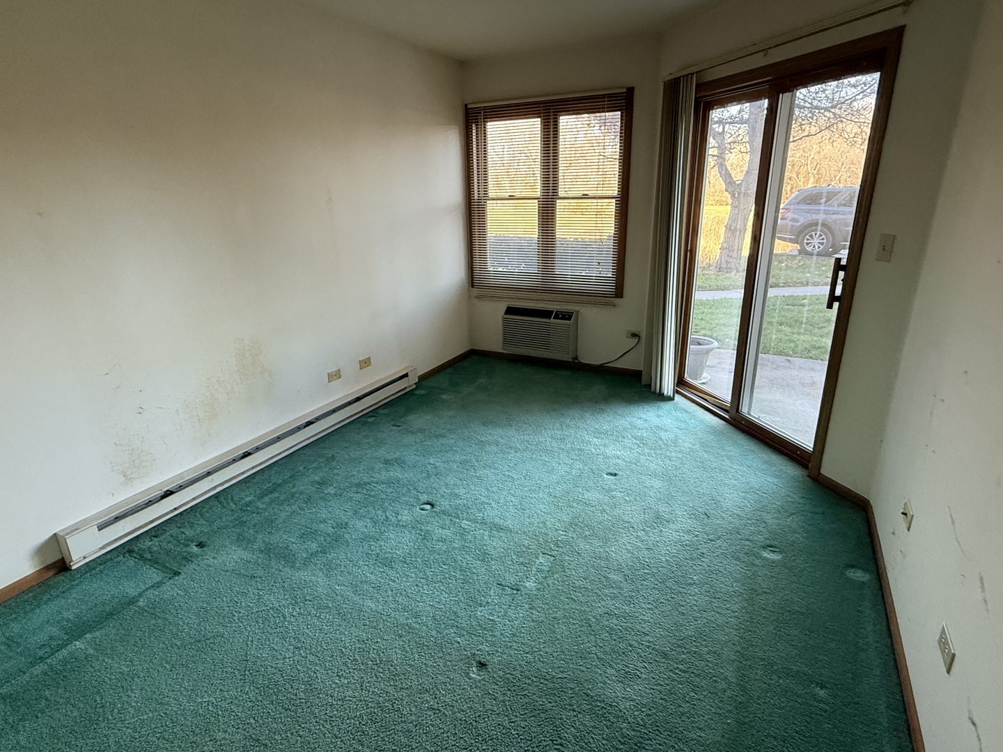 1345 Cunat Court, Unit 1B Lake In The Hills, IL 60156 - Photo 10 of 16 an empty room with windows