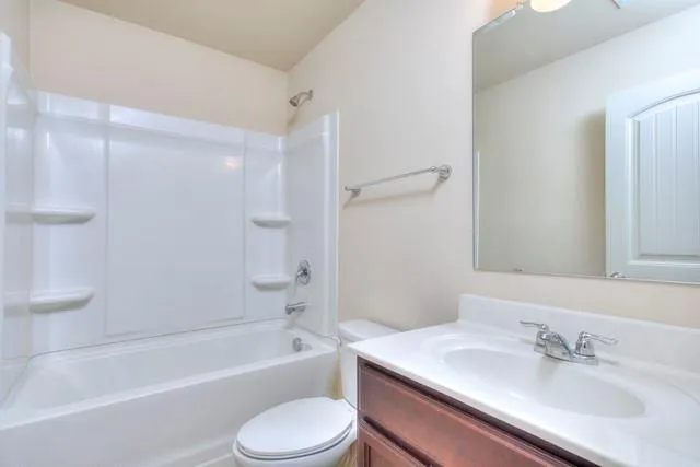 a bathroom with a sink toilet and bathtub