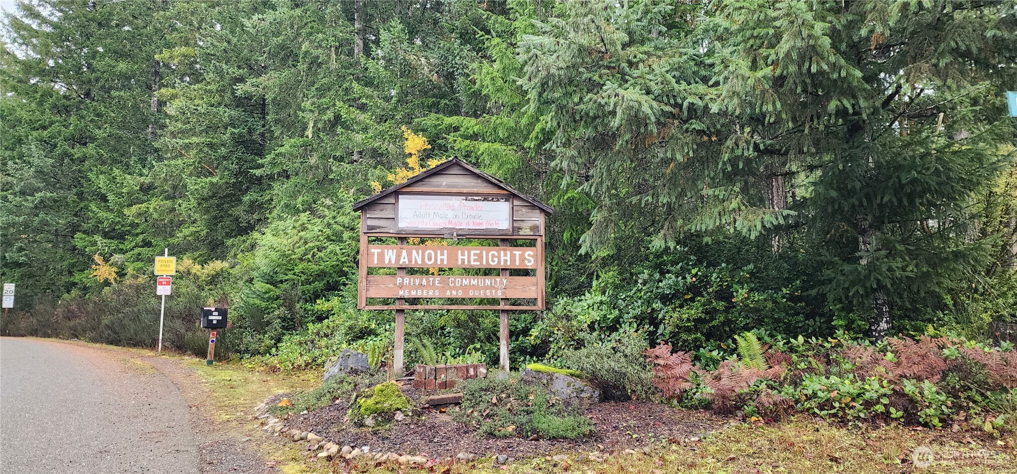 0 East Twanoh Heights Road North Belfair, WA 98528 - Photo 19 of 29 a sign board with a house in the background